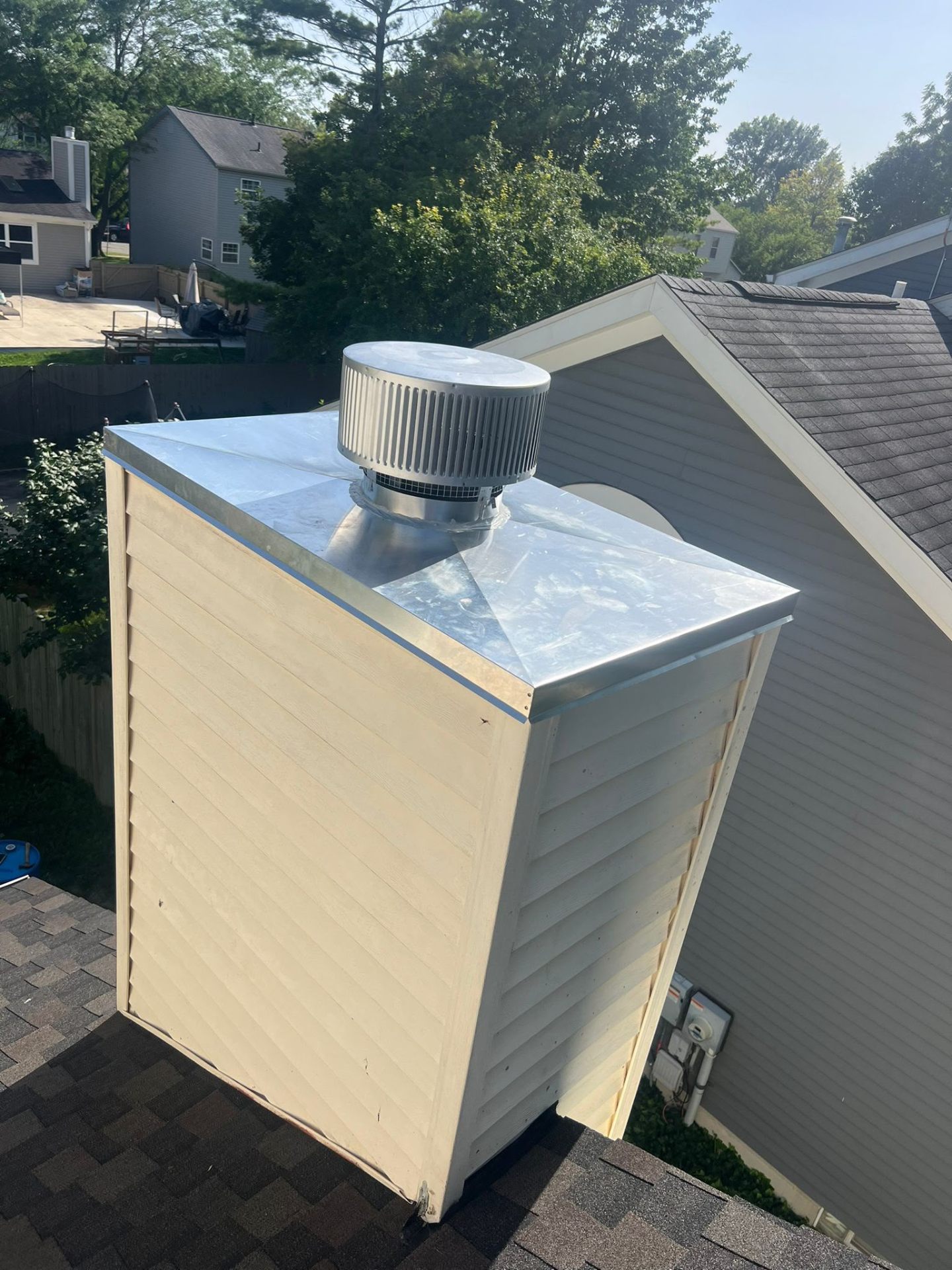Side profile of a new stainless chase cover install