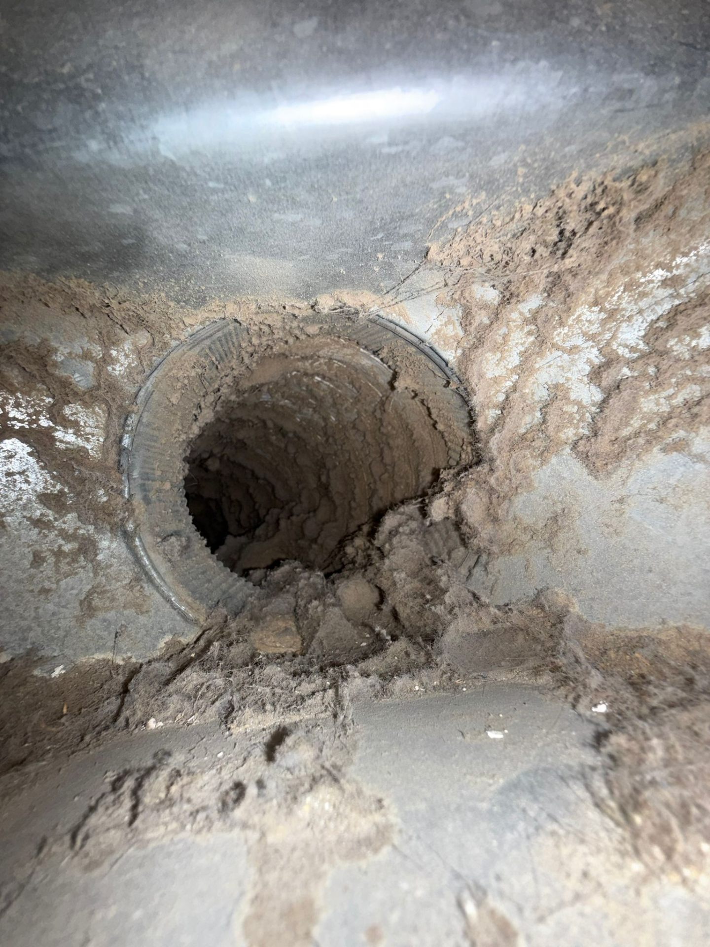 ChimCrew technician performing dryer vent cleaning on an Ohio home