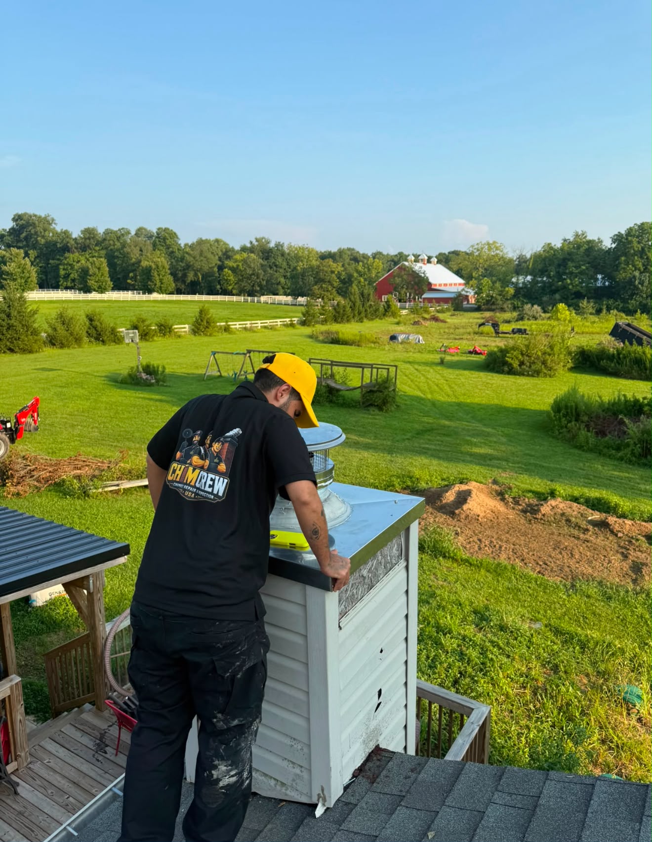 ChimCrew tech fitting a new chase cover and cap on a country home