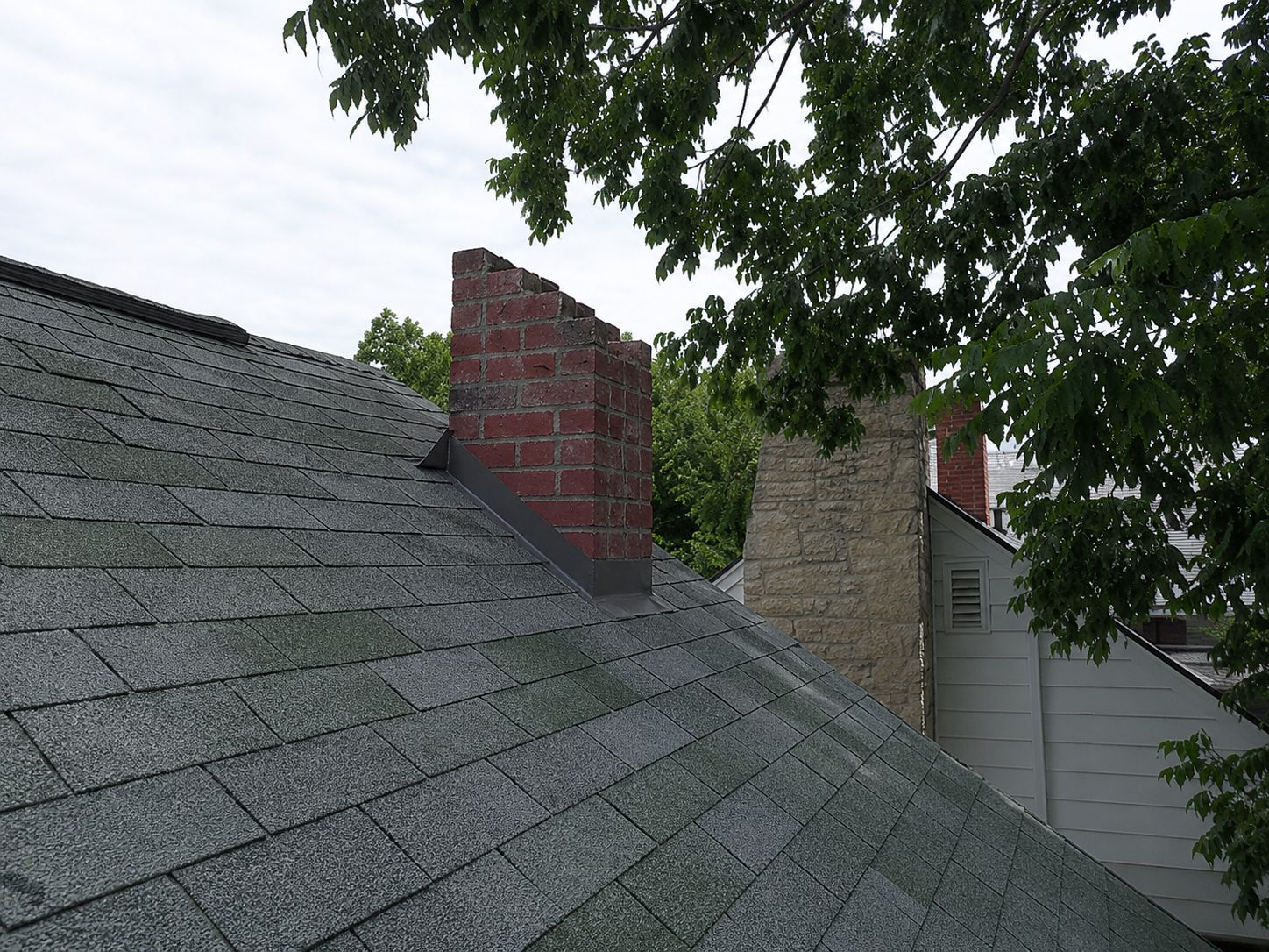 Open brick stack → capped, flashed, watertight — before