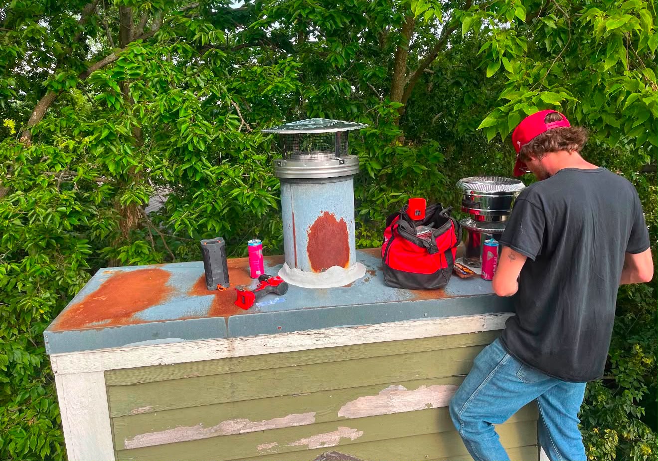 ChimCrew tech replacing a rusted chase cover and chimney cap