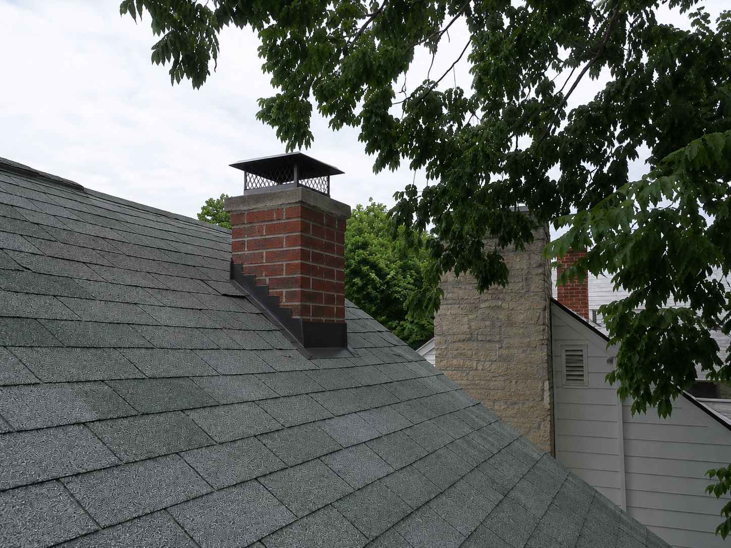 Open brick stack → capped, flashed, watertight — after