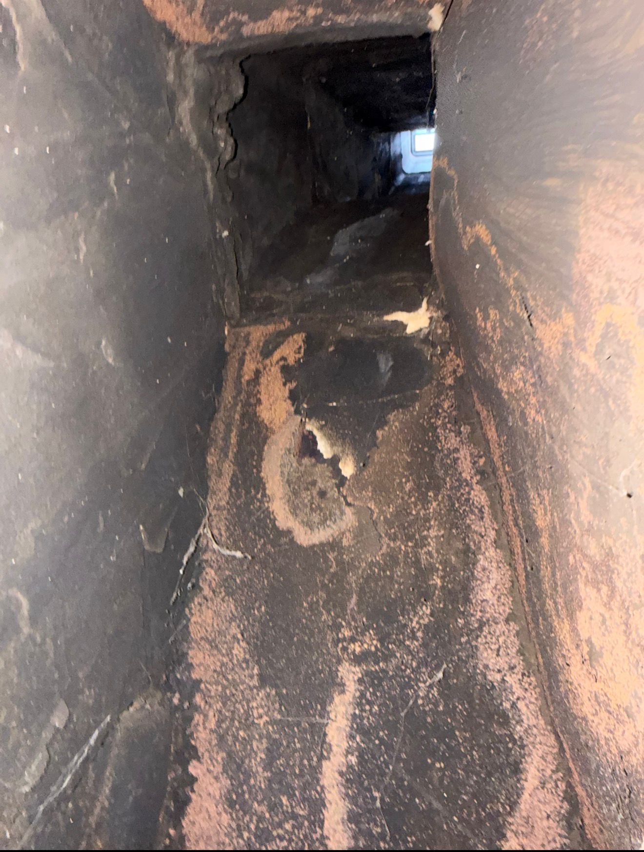 Heavy creosote → smooth, sealed flue — before